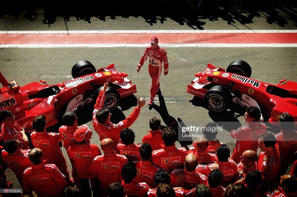 BARCELONA, SPAIN - MAY 6:  Michael Schumacher of Germany and Ferrari arrives for a Ferrari team photo prior to practice for the Formula One Spanish Grand Prix at the Circuit de Catalunya on May 6, 2005 in Barcelona, Spain. (Photo by Clive Mason/Getty Images)